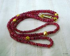 "ruby gemstone faceted beads necklace strand with 6 gold beads. nice design good for jewellery collection. Note - there is wax inside the gold beads. length - 56 cm(22\") we can adjust the length. weight - 16.5 grams material - ruby gemstones & gold beads." Gold Ruby Beaded Necklaces With Gemstone Beads, Gold Ruby Beaded Necklace With Faceted Beads, Gold Ruby Necklace With Faceted Beads, Faceted Bead Necklace, Ruby Gemstone, Nice Design, Beads Necklace, Jewellery Collection, Faceted Bead