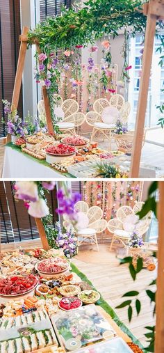 an outdoor buffet with flowers and greenery on the top, next to a table full of food