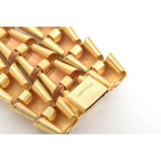 This is part of Chairish’s Costume Jewelry assortment.  This sculptural bracelet of multi-directional rows of inverted triangles is gold plated. There are 3 rows. It is signed on the clasp; Marcy Feld and it is from the 80's. It is modern, now and tres chic!  It will go day to evening. Fits the wrist beautifully. This needs a size 6 or 6.5 wrist or max 6.85 " Wrist which will be a snug fit. The dimensions are: 7" L/W when opened. When closed it is 3.5: W/L on the outer exterior side to side. The Gold Modernist Cuff Bracelet For Formal Occasions, Modernist Gold Jewelry For Evening, Evening Fits, Sculptural Bracelet, Inverted Triangle, The 80's, Tres Chic, Best Wear, Triangles