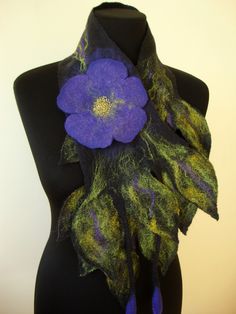 "Green felt scarf flower made by hand wet felting technique. Sheep wool is known to be a natural temperature regulator, it maintains your natural body temperature, what will insure your comfort in the heat and in the cold. Best gift for woman! Purple color flowers give a charm and extravagance to the wool scarf. Superfine merino wool is soft and comfortable even next to your skin and breathes in warm and cold weather. Made of merino wool the scarf is very soft, warm, and light which makes it com Handmade Purple Scarves For Gifts, Handmade Purple Scarves As Gifts, Felt Flower Scarf, Purple Colour Flowers, Felting Art, Felted Art, Nuno Felt Scarf, Felted Scarf, Body Adornment