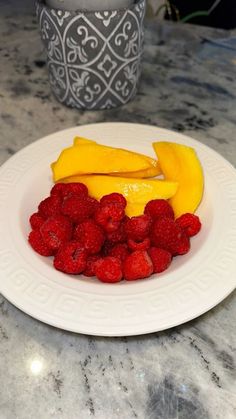 a white plate topped with sliced up fruit