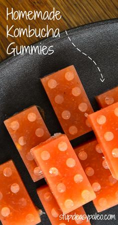 homemade kombucha gummies on a black plate with polka dot design and text overlay