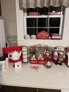 the kitchen counter is covered with various items for baking and other holiday treats, such as hot cocoa