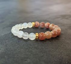 Sunstone bracelet and moonstone jewelry make a perfect Mother's Day gift for mom, sister, or self-care, ideal for yoga enthusiasts seeking healing crystals. 𝗗𝗘𝗧𝗔𝗜𝗟𝗦: 💎 Included: One Sunstone and Moonstone Bracelet with 2 gold spacers. 💎 This is an 8mm Stretch Beaded Bracelet with 2 Spacers so it will have some stretch. 𝗛𝗢𝗪 𝗧𝗢 𝗢𝗥𝗗𝗘𝗥: 💎 Please measure your wrist with measuring tape and add 1 inch to it for a snug fit. Select your size from the drop down. 𝗗𝗜𝗠𝗘𝗡𝗦𝗜𝗢𝗡𝗦: 💎 Bead size: 8mm 💎 Lengths offered: 6.5" to 7.5" 𝗠𝗔𝗧𝗘𝗥𝗜𝗔𝗟𝗦: 💎 Real Gemstone Sunstone and Moonstone( Not heat-treated or color-dyed) 💎 18k Heavy Gold Plated Stainless Steel Spacers  💎 Elastic cord 𝗦𝗛𝗜𝗣𝗣𝗜𝗡𝗚: 💎 Processing time is 1-8 business days and you will receive it 2-3 days Moonstone Bracelets As A Gift, Round Moonstone Bracelets For Gift, Moonstone Beaded Bracelets As Gift, Everyday Moonstone Bracelets With Gemstone Beads, Adjustable Moonstone Crystal Bracelet For Meditation, Moonstone Crystal Bracelet Gift, Everyday Moonstone Gemstone Beads Bracelets, White Rose Quartz Crystal Bracelet As A Gift, Round Moonstone Beaded Bracelets As Gift