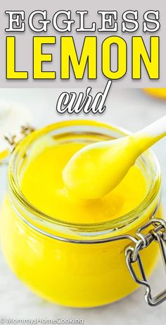 a jar filled with lemon curd sitting on top of a table