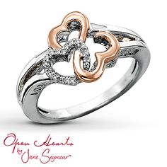 an open heart ring with two hearts in the center and diamonds on each side,