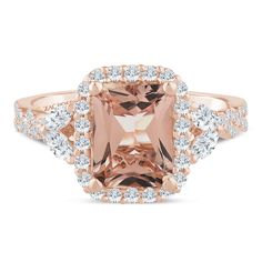 an 18k rose gold ring set with a cushion cut morganite surrounded by diamonds