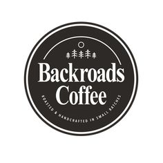 the backroads coffee logo is black and white, with trees in the background