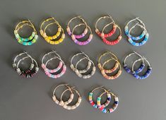 Who loves subtle Taylor accessories?! Or maybe you're just looking for some beautiful beaded hoop earrings in various colors! These 1.75 inch hoops are heishi beaded in various colors and are so pretty! I have designed a pair of earrings themed to each of Taylor's albums and also created a pair celebrating all eras in one!  These hoops are hypoallergenic and lightweight. They come in various finishes: gold, rose gold, and silver. Pair it with one of my top selling jewelry dishes and you'll have the perfect gift for the Taylor fan in your life! All earrings are buy 5 get one of equal or lesser value free! Feel free to message me with your choice of free earring, otherwise I will choose a pair to add to your order. Happy shopping! Top Selling Jewelry, Diy Jewlery, Free Earrings, Heishi Beads, Beaded Hoop Earrings, Beaded Hoops, Jewelry Dish, Selling Jewelry, Clay Beads