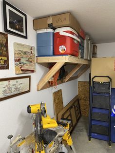 a garage with tools and boxes on the shelves