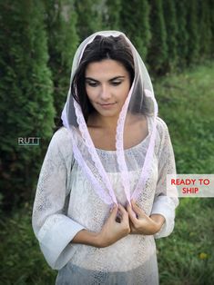 a woman wearing a veil and holding her hands in front of her face with the words ready to ship written on it