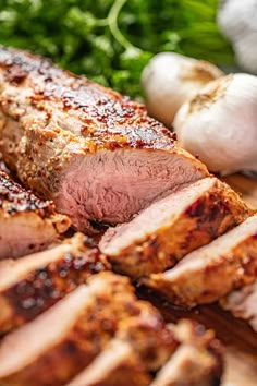 sliced meat and vegetables on a cutting board