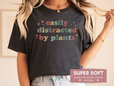 This Retro Easily Distracted By Plants Shirt is the perfect gift for any Plant Lover! Every shirt is made with the highest quality materials and feels super soft and cozy to wear! ❤️ HOW TO ORDER ❤️ 1. Look through photos for sizing and color options 📏 2. Select size and color from the drop down menus  👌 3. Add to cart & Place order 🛒 4. Your shirt is now off to production and will be ready for shipment in 1-3 days! 🎁 📏 SHIRT SIZING 📏 There are 5 sizes, ranging from Small to 2X-Large. 📦 P Bookworm Shirt, Reading Shirts, Inspirational Tees, 1st Day Of School, Club Shirts, The Teacher, School Shirts, Mom Humor, Teacher Shirts