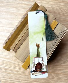 a bookmark with an image of a woman sitting at a desk