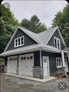 a two car garage in front of a house