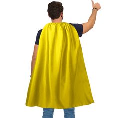 a man wearing a yellow cape and pointing to the side with his hand in the air