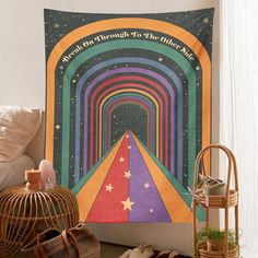 a tapestry hanging on the wall in a bedroom