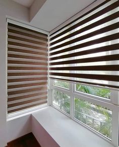 a window with blinds that are open and closed