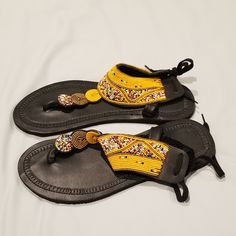 These Sandal Are Gorgeous. Slip On And Tie In The Back On Your Achilles Tendon. Pictures Don't Do Them Justice. Black Beaded Sandals For Spring, Spring Black Beaded Sandals, Yellow Adjustable Ankle Strap Sandals, Adjustable Sandals For Festivals, Yellow Bohemian Sandals For Festival, Adjustable T-strap Sandals For Festival, Adjustable Handmade Yellow Sandals, Handmade Adjustable Yellow Sandals, Handmade Yellow Adjustable Sandals