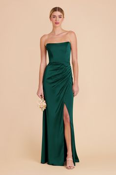 a woman in a long green dress