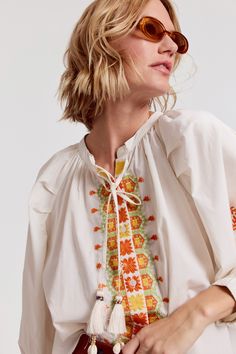 Our best-selling Minka Shirt has intricate embroidery in rich colors of the season. Loose, blousy, and in our crisp poplin.

 Rochelle Behrens reimagined how shirts should fit and feel. Our patented No Gape® button technology, seamlessly designed into every shirt and shirtdress we design, eliminates blouse gape. Finally say bye-bye blouse gape, and hello to The Shirt.

  
 * Imported 
 * 100% Cotton Long Sleeve Orange Top With Floral Embroidery, Orange Long Sleeve Blouse With Floral Embroidery, Orange Floral Embroidered Long Sleeve Top, Orange Cotton Top With Floral Embroidery, Spring Embroidered Orange Blouse, Orange Floral Embroidered Cotton Top, Folk Style Long Sleeve Shirt For Spring, Orange Embroidered Cotton Blouse, Orange Cotton Blouse With Floral Embroidery