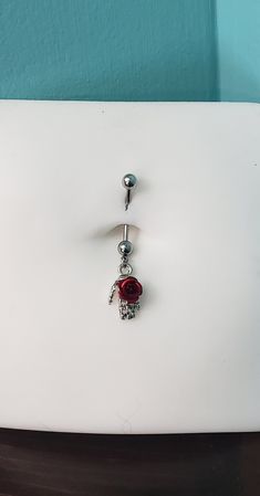 In addition to the standard 11mm steel or PTFE plastic for pregnancy belly button rings, this jewelry has the option to be made from longer-than-standard stainless steel bent shaft - hypoallergenic, anti-rust, and will not discolor over time.  You'll be receiving the same 14g 316L stainless steel as with normal belly ring jewelry, only longer. Steel skeletal hand with rose in multiple sizes.    5mm steel top ball    5mm bottom ball with iron charm    Skeletal Hand - 10mm x 17mm Measures 23mm fro Normal Belly, Hand With Rose, Skeletal Hand, Clay Rose, Pregnancy Belly, Button Rings, Belly Ring, Pregnant Belly, Skeletal