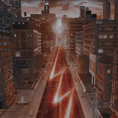 a city street filled with lots of traffic and tall buildings under a dark cloudy sky