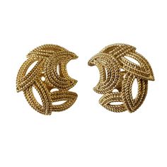 These vintage Crown Trifari clip-on earrings are a stylish addition to any jewelry collection. The gold tone base metal gives them a classic feel, while the brand name adds a touch of elegance. The clip-on closure ensures they can be worn comfortably by anyone without the need for pierced ears. 1" h by 0.75"w by 0.25" D    Perfect for a night out or to add a touch of glamour to an everyday outfit, these Trifari earrings are a must-have for vintage jewelry enthusiasts. Chic Formal Metal Clip-on Earrings, Vintage Gold-tone Clip-on Earrings For Evening, Vintage Gold Plated Clip-on Earrings For Formal Occasions, Vintage Yellow Gold Plated Clip-on Earrings, Chic Gold-tone Gold-plated Clip-on Earrings, Classic Metal Clip-on Earrings, Chic Gold-tone Metal Clip-on Earrings, Chic Gold-tone Clip-on Earrings, Classic Metal Clip-on Earrings For Evening