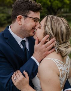 a bride and groom share a tender moment together