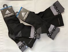 6 Pairs ADIDAS Comfort Cushioned Socks Crew 2 sets of 3 pairs each = total 6 pairs  Adult one size fits all (6-12).   Sleek, lightweight feel, arch compression gives you a secure and snug fit.  Climalite moisture-wicking keeps your feet dry from sweat.  Cushioned in the heel and toe for comfort.  6 pairs for sale  Fabric: 97% Polyester / 3% Spandex.  Care: Machine Washable.  Socks are authentic Adidas product and come complete with hang tags.  Moisture-wicking, keeps feet dry Breathable Stretch LARGE - Size: 10-13  Care: Machine wash, tumble dry Black/Gray Sock Size: 10-13   Fits   Shoe Size:  7-12 Cushioned Socks, Gray Socks, Grey Socks, Fabric Sale, 2 Set, Hang Tags, Crew Socks, Adidas Men, One Size Fits All