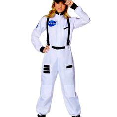 a woman in an astronaut costume posing for the camera with her hand on her head