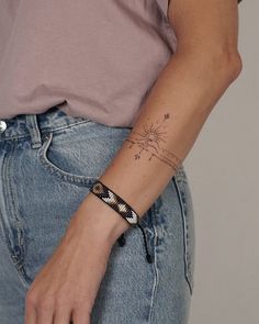 a woman with a tattoo on her arm