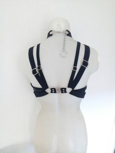 Gothic Harness For Cosplay, Fitted Punk Harness For Alternative Fashion, Gothic Strapped Harness For Cosplay, Black Punk Harness For Festival, Strapped Gothic Harness For Cosplay, Edgy Black Harness For Festivals, Edgy Fitted Harness For Alternative Fashion, Fitted Strapped Harness For Party, Black Punk Style Festival Harness