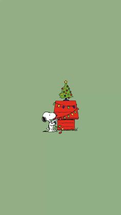 snoopy and his christmas tree on the green background