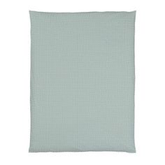 a green and white checkered pillow on a white background