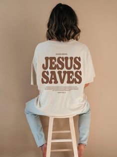 "Introducing our new \"Jesus Saves\" tshirt, a perfect expression of faith and style. This Christian shirt features a timeless design and a powerful message. This shirt is not only a fashionable choice but also a meaningful one. It serves as a reminder of the saving grace of Jesus Christ and the hope and redemption that comes with it. It's a great way to boldly express your faith and share your beliefs with others! ⁑ F U N ⁑ F A C T S ⁑ ☼ Unisex Adult Sizes ☼ 100% Cotton ☼ Washer & Dryer Safe ☼ Grace T Shirt Design, T Shirt Jesus Christ, Faith Shirt Ideas, Tshirt Design Christian Faith, Cute Christian Shirts For Women, Cute Jesus Shirts, Church T Shirt Designs, Faith Based Apparel, Christian Streetwear T-shirts