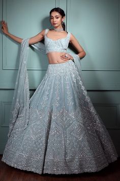 Luxury Blue Lehenga With Mirror Work, Luxury Blue Choli With Chikankari Embroidery, Luxury Light Blue Bollywood Blouse Piece, Luxury Blue Glamorous Lehenga, Glamorous Luxury Blue Lehenga, Luxury Fitted Silver Choli, Luxury Bollywood Light Blue Choli, Luxury Blue Elegant Choli, Cheap Fitted Wedding Lehenga