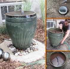 a large green planter sitting on top of a pile of rocks next to a metal ball