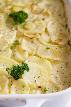 a casserole dish with potatoes and parsley