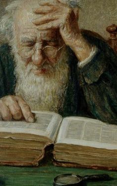 an old man reading a book while holding his hands to his face