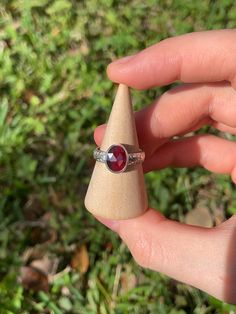 Faceted rhodolite garnet stone set in 999 fine silver and 925 sterling silver on a patterned band. US Ring Size 6. Silver Garnet Rings With Bezel Setting, Garnet Bezel Set Ring Jewelry, Rhodolite Garnet Ring, Garnet Ring, Garnet Stone, Rhodolite Garnet, Garnet Rings, Stone Settings, Fine Silver