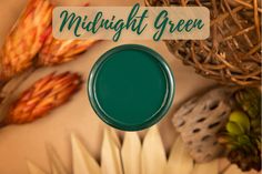 the words midnight green are above an arrangement of leaves and flowers