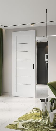 an open door in a white room with green carpet