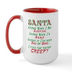 a red and white coffee mug with santa written on it