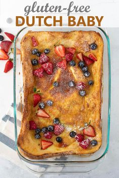 a casserole dish filled with fruit and topped with powdered sugar on top