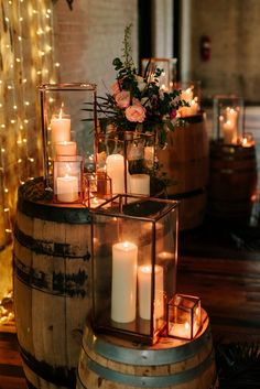 candles are lit on top of a barrel