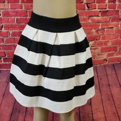 Piace Skirt Black And White Stripe Very Classy Well Made Size Large New With Tags Skirt Is Beautiful With A Formed Flare. Versatile With Boots, Leggings, Heels. Black And White Is Always In Style! Approximate Measurements Waist Flat - 14" With A Comfortable Stretch To 17" Bottom Flare Flat - 30" Length 18.5" 70% Polyester 30% Spandex Chic Summer Skirt With Vertical Stripes, Chic Vertical Stripes Midi Skirt, Black Spring Bottoms With Striped Hem, Spring Black Bottoms With Striped Hem, Trendy Striped Mini Skirt For Summer, Black Bottoms With Striped Hem For Spring, Chic Skirt With Striped Hem And Relaxed Fit, Chic Vertical Stripes Skirt For Spring, Chic Relaxed Skirt With Striped Hem