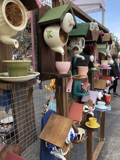 a bunch of bird houses that are on display