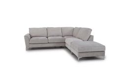 a gray sectional couch sitting on top of a white floor