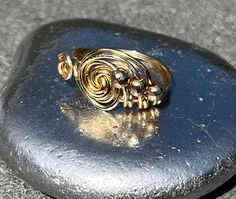 Modern Twist Gold Bypass Ring As Gift, Gold Bypass Ring With Modern Twist For Gift, Gold Spiral Ring With A Modern Twist, Gold Spiral Jewelry, Gold Spiral Bypass Ring As Gift, Gold Swirl Handmade Jewelry, Gold Swirl-shaped Handmade Jewelry, Gold Handmade Swirl Jewelry, Gold Swirl Wire Wrapped Jewelry